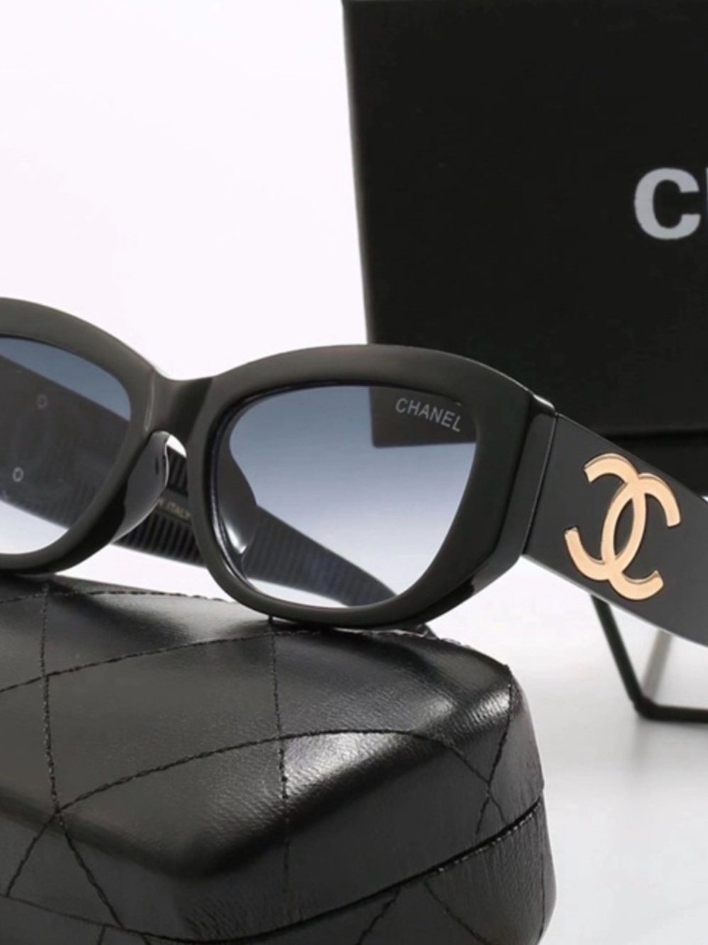 CHANEL Black Sunglasses with Gold CC Emblem and Gradient Blue Lenses